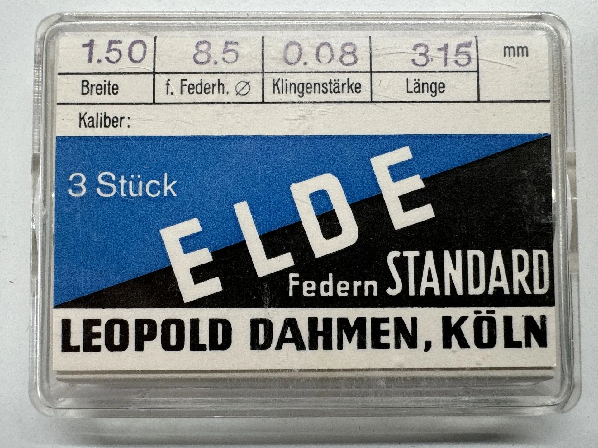 ELDE Feder Standard Set Verpackung mit drei Uhrmacher-Federn der Marke ELDE von Leopold Dahmen, Köln.