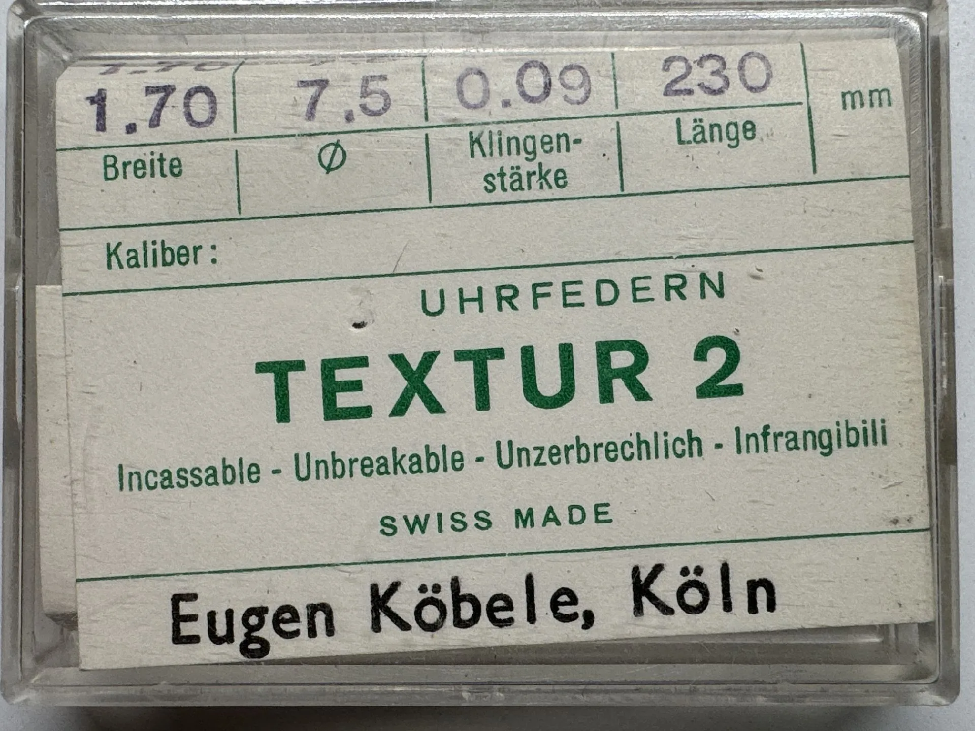 Verpackte Ersatz-Uhrfeder Textur 2 für Armbanduhren, mit technischen Angaben auf dem Etikett.