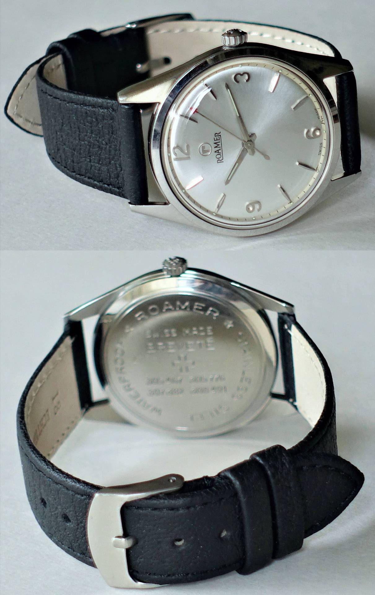 Silberfarbene Armbanduhr mit schwarzem Armband und schlichtem Zifferblatt.