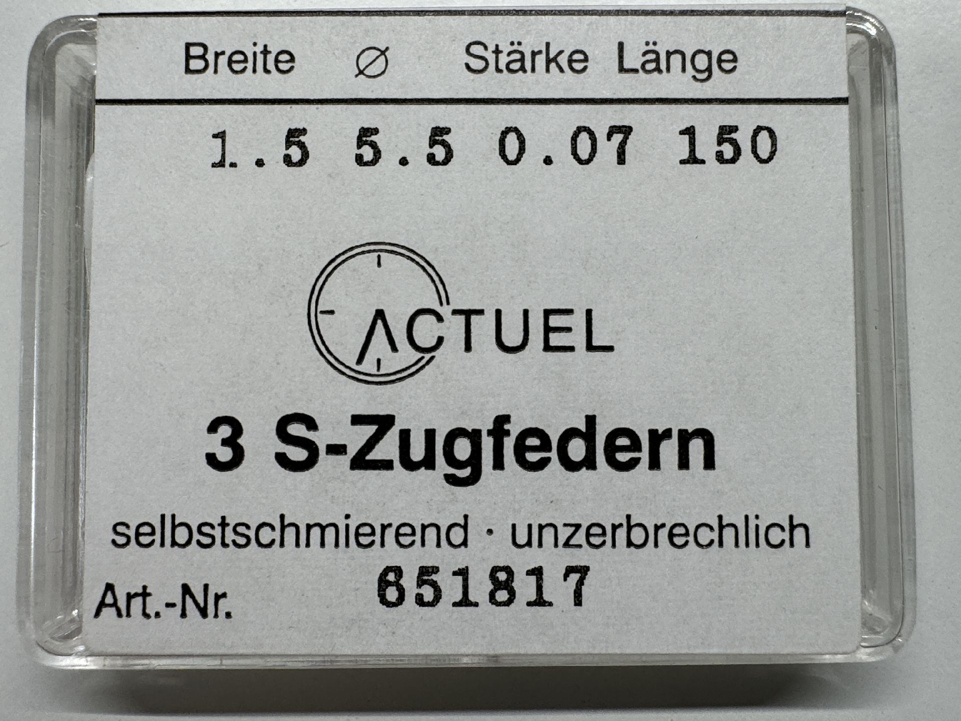 Verpackung mit drei selbstschmierenden S-Zugfedern für Uhren.