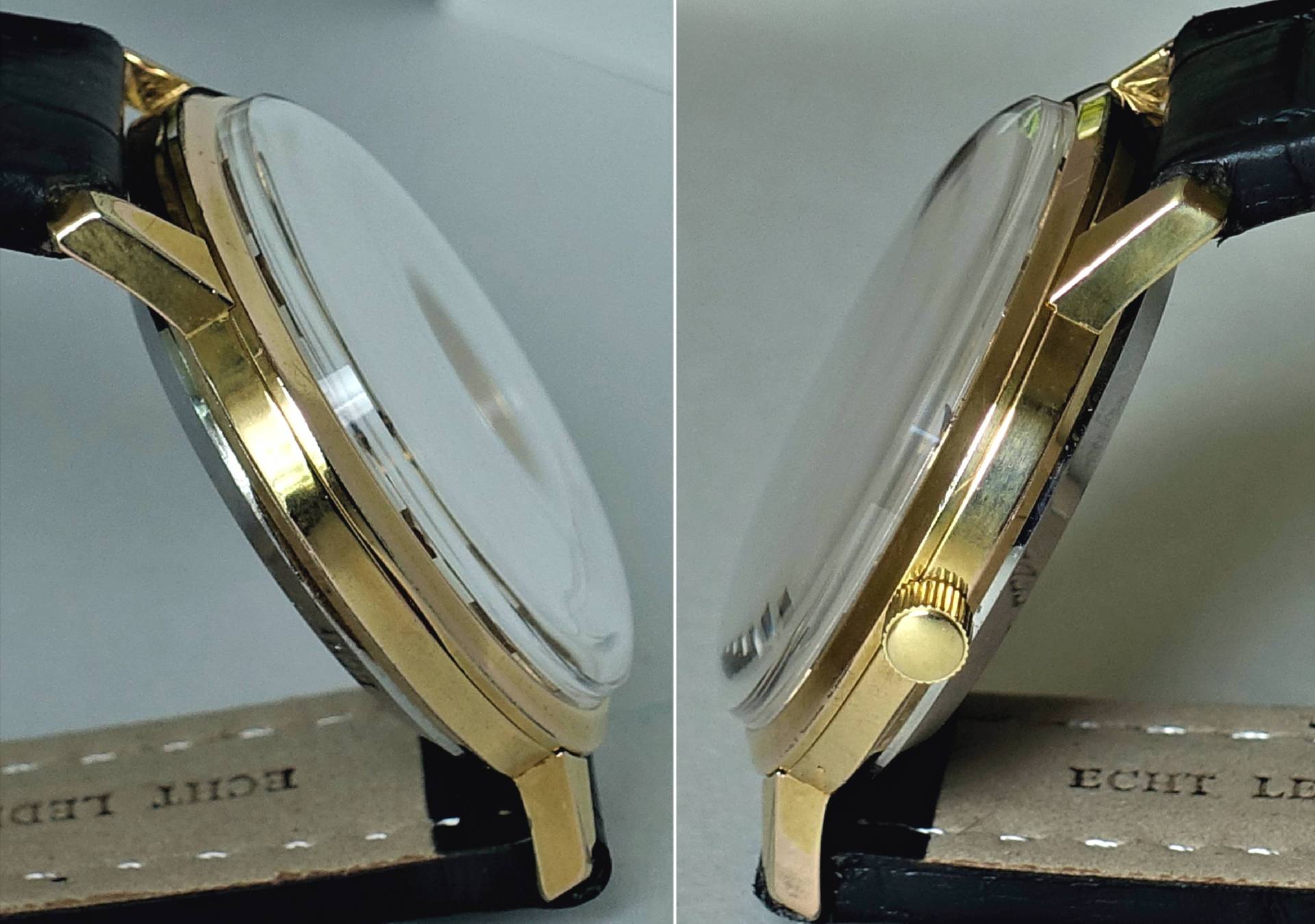 Flache Armbanduhr mit goldfarbenem Gehäuse, schwarzem Armband und seitlicher Krone.