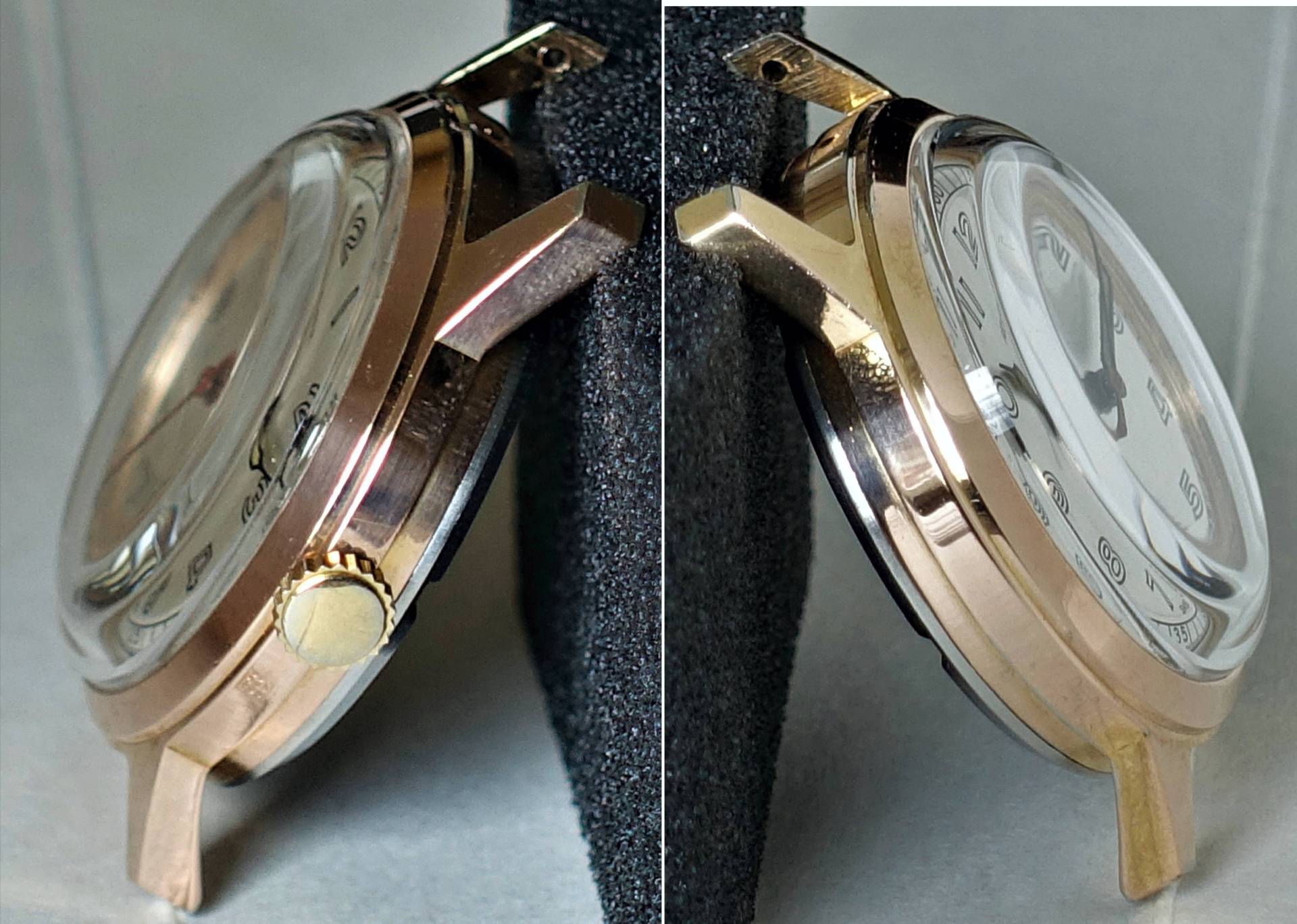 Goldfarbenes Gehäuse einer Armbanduhr mit weißem Zifferblatt und gewölbtem Glas.