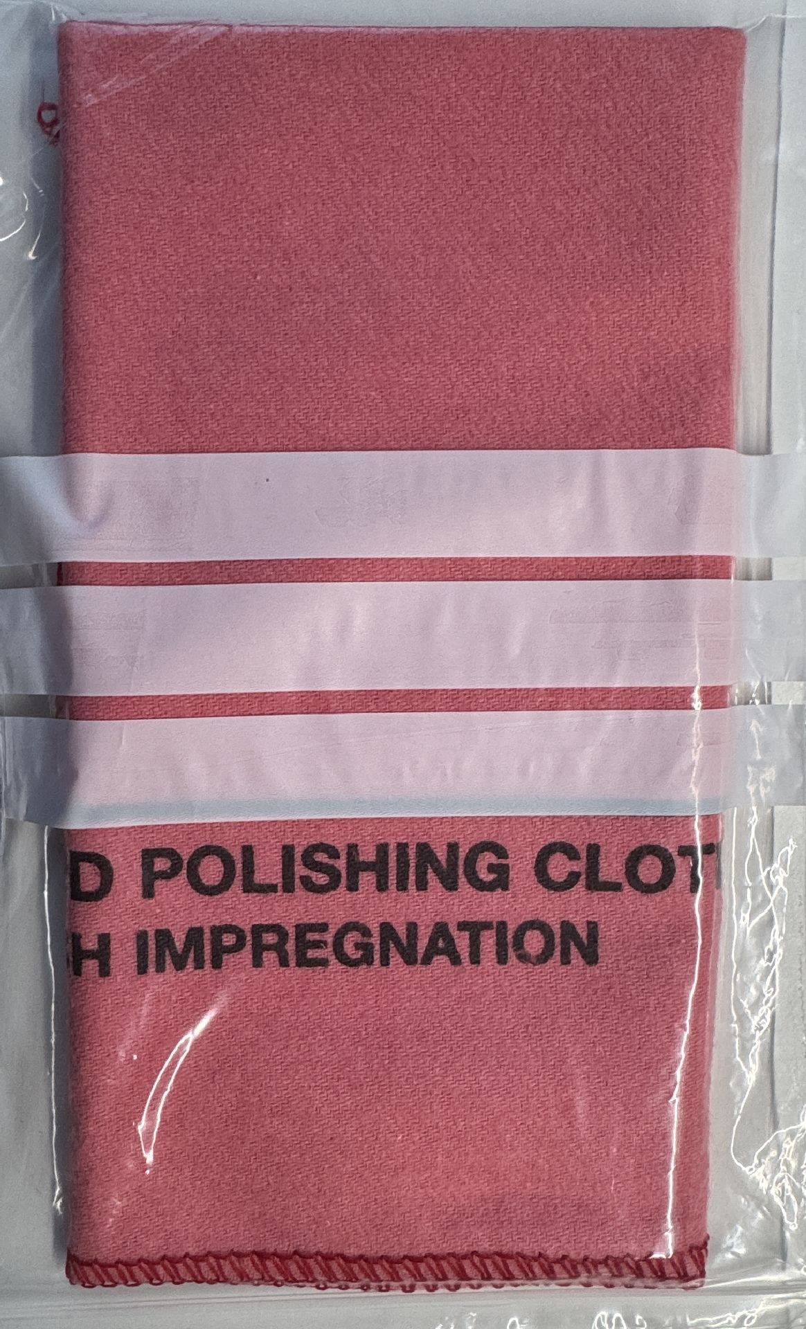 Poliertuch für Uhren Rotes Poliertuch aus Stoff zur Reinigung und Pflege von Uhren, in Folie verpackt.