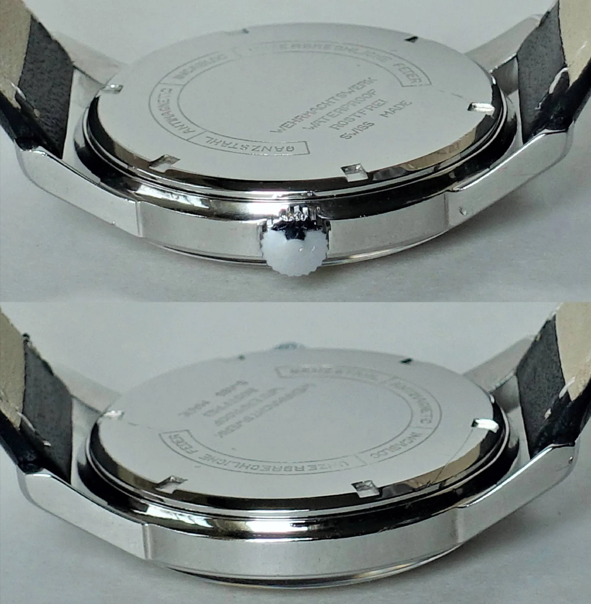Runder silberfarbener Edelstahlboden einer Armbanduhr mit schwarzem Lederarmband.