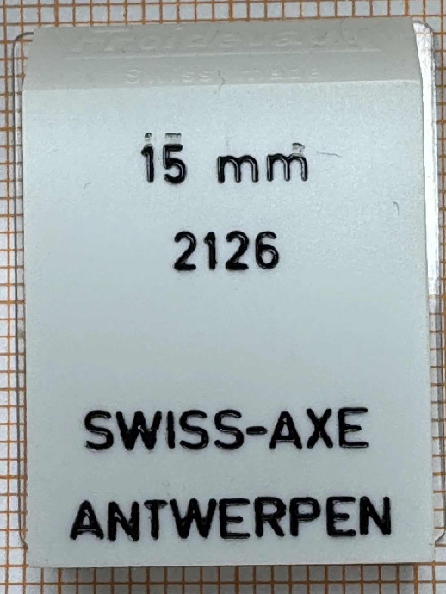 Federsteg 15mm Verpackung für einen 15 Millimeter Federsteg für Uhren, mit Aufdruck Swiss-Axe Antwerpen.