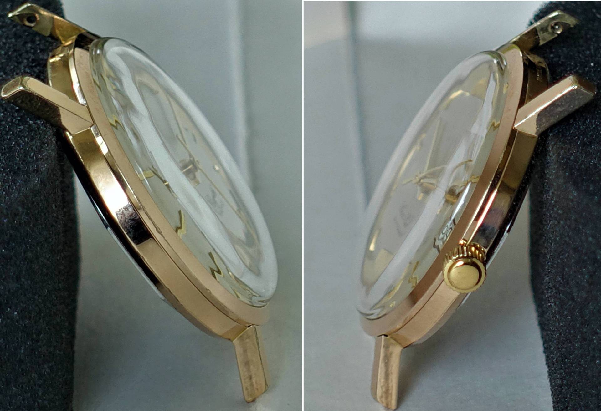 Flaches, goldfarbenes Uhrengehäuse mit gewölbtem Glas und seitlicher Krone.