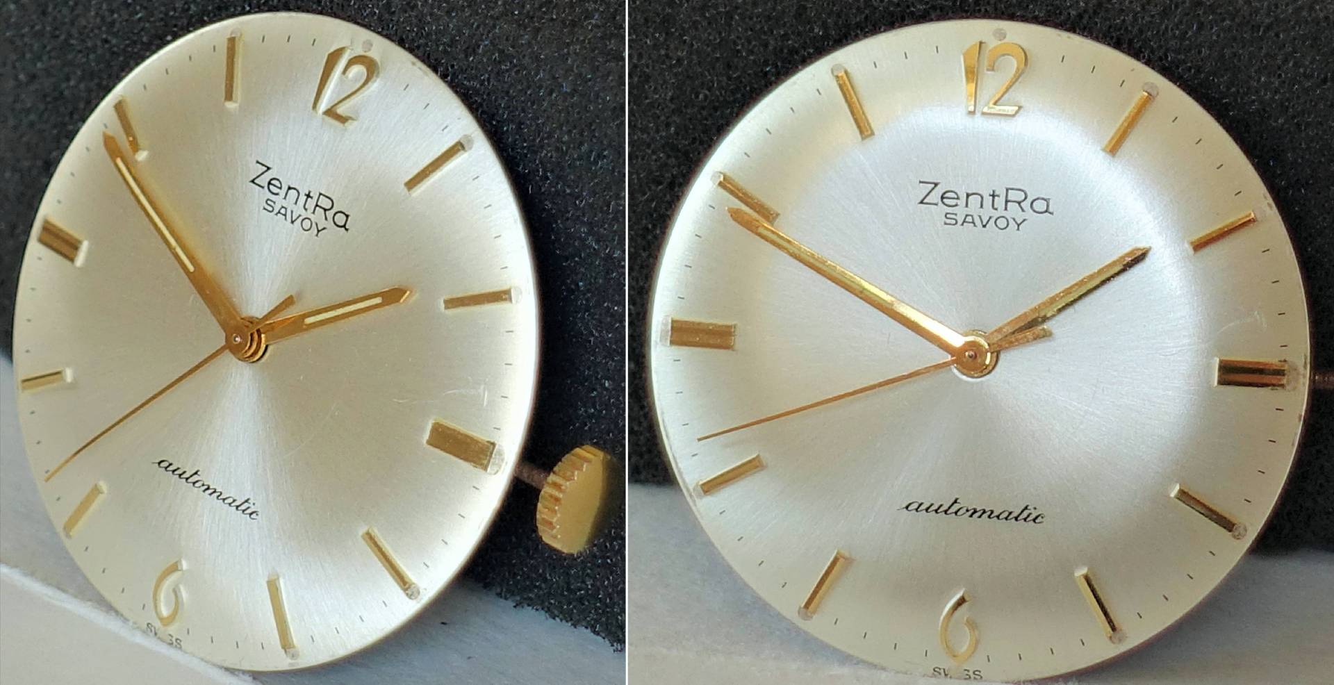 Silberfarbenes Zifferblatt mit goldfarbenen Zeigern und Indizes für Armbanduhren.