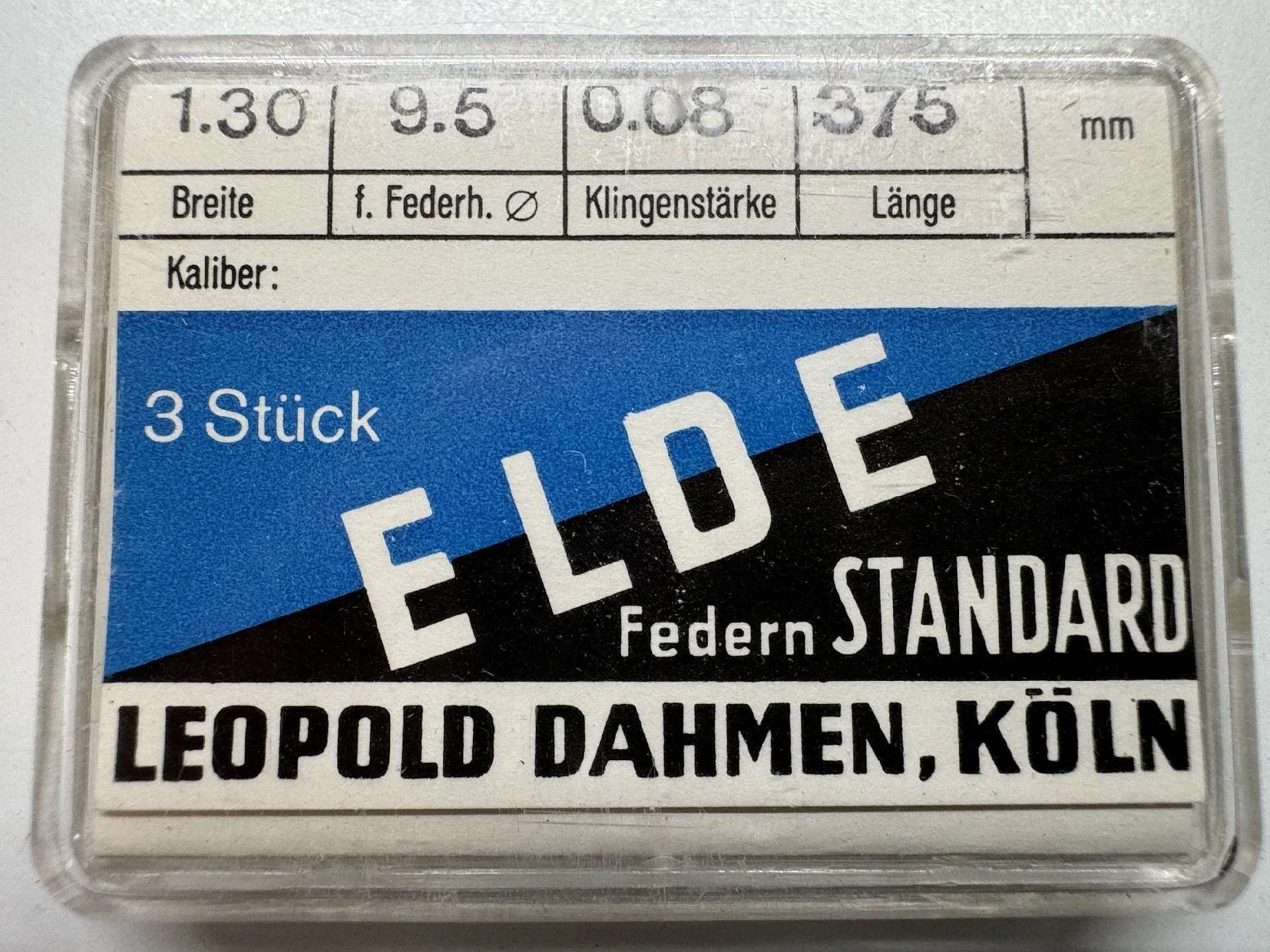 Verpackung mit drei ELDE Standard Federn für Uhrwerke, beschriftet mit technischen Angaben.