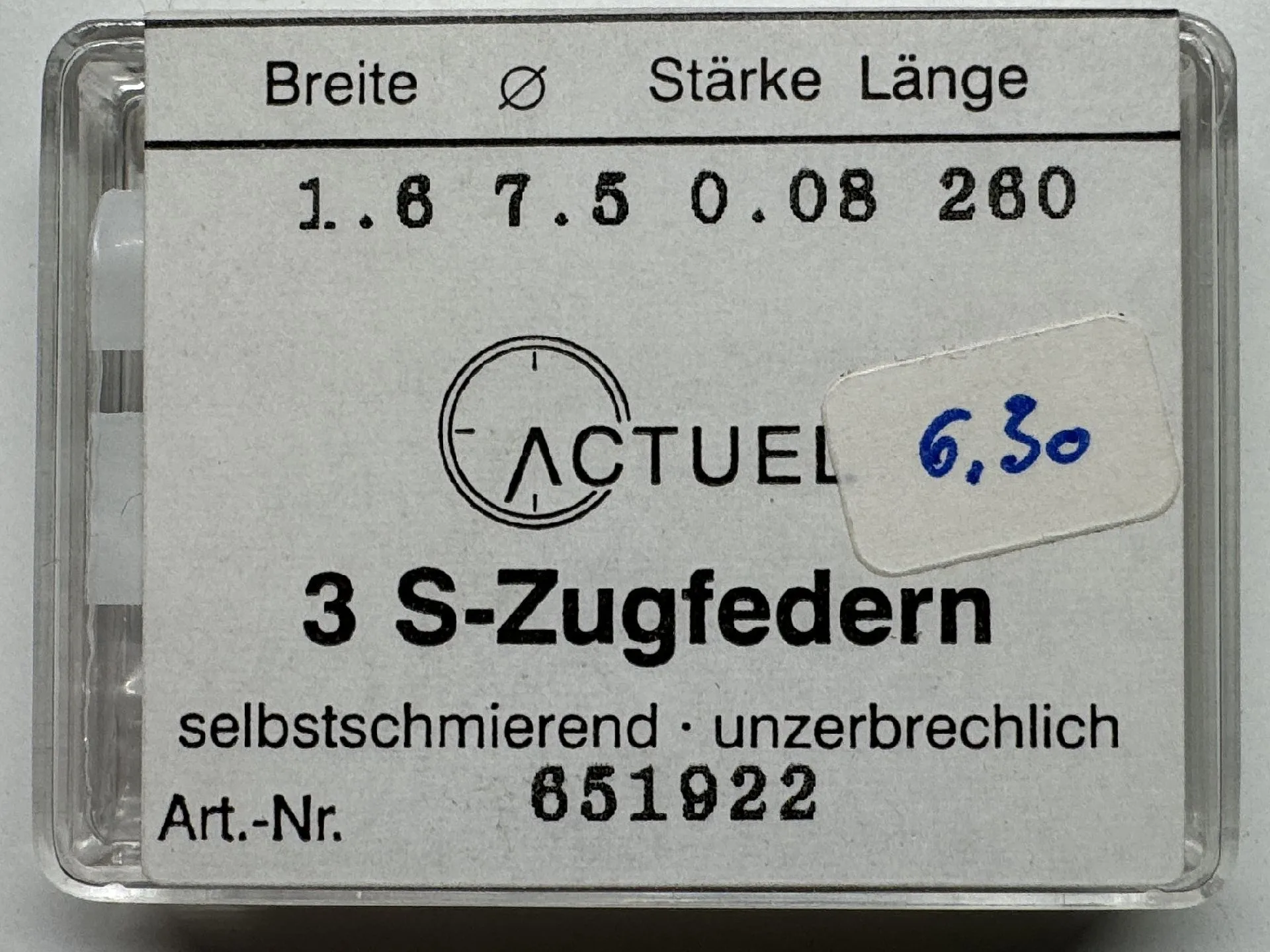 Zugfeder Set Set mit drei silberfarbenen Zugfedern für Uhren in transparenter Kunststoffbox.