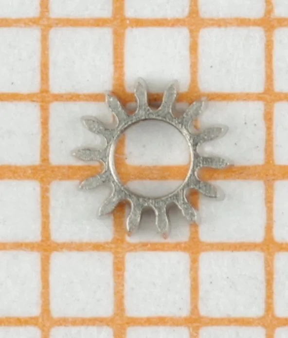 Zahnscheibe Metall Kleine gezackte Zahnscheibe aus Metall für Uhrwerke.
