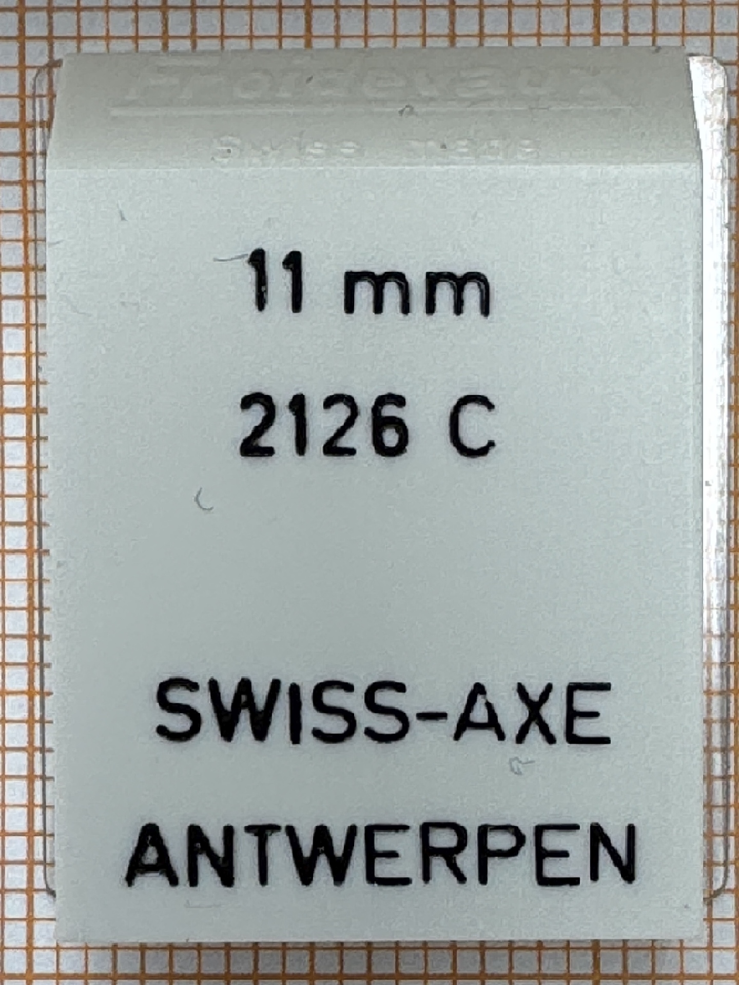 Weißes Ersatzteil für Uhrwerke mit der Aufschrift 11 mm 2126 C von SWISS-AXE.