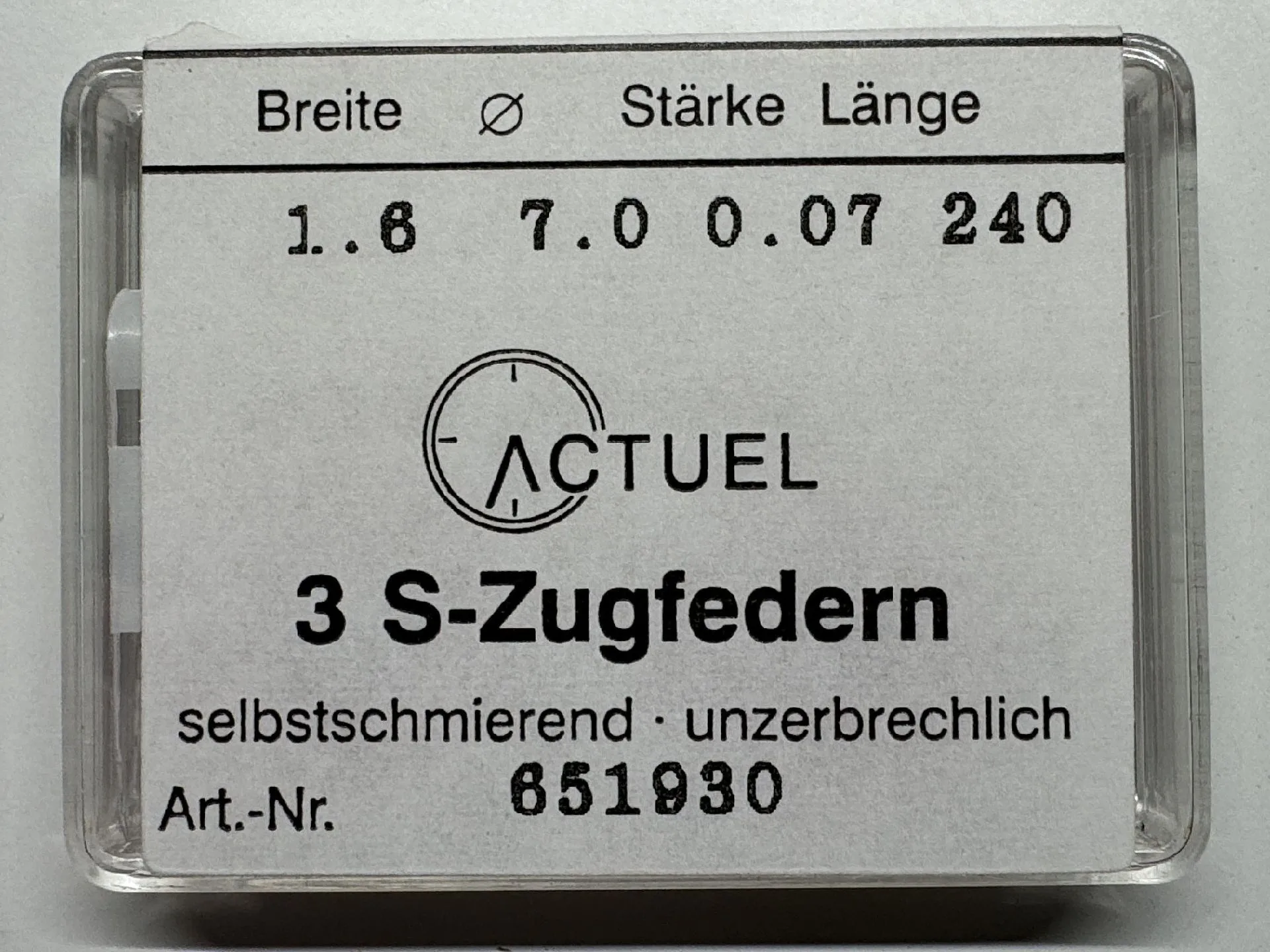 Zugfeder Set Verpackung mit drei silberfarbenen Zugfedern für Uhren.