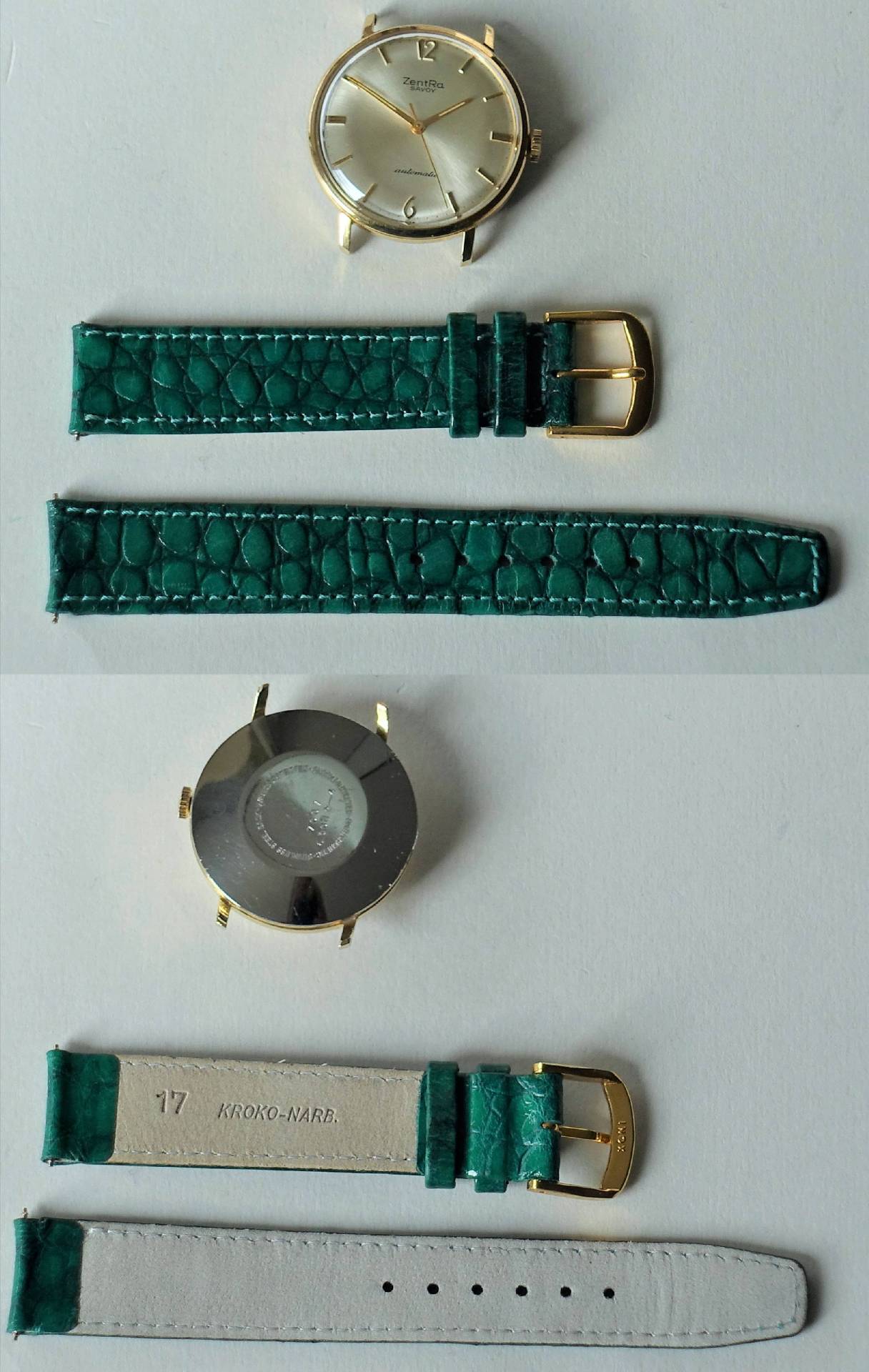 Goldfarbene Armbanduhr mit silberfarbenem Zifferblatt und grünem Uhrenarmband mit Kroko-Prägung.