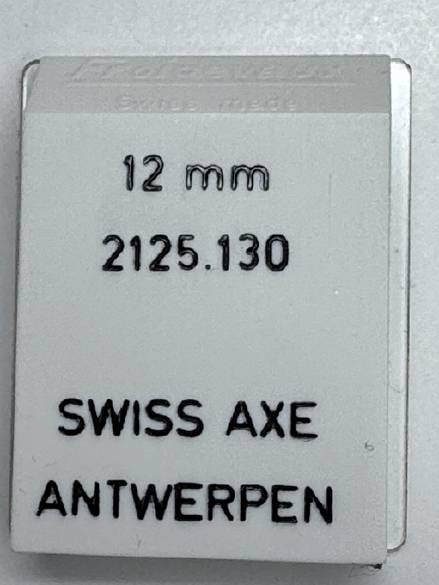 Verpackung für eine 12 mm Swiss Axe für Uhren, mit Aufschrift "2125.130" und "Antwerpen".