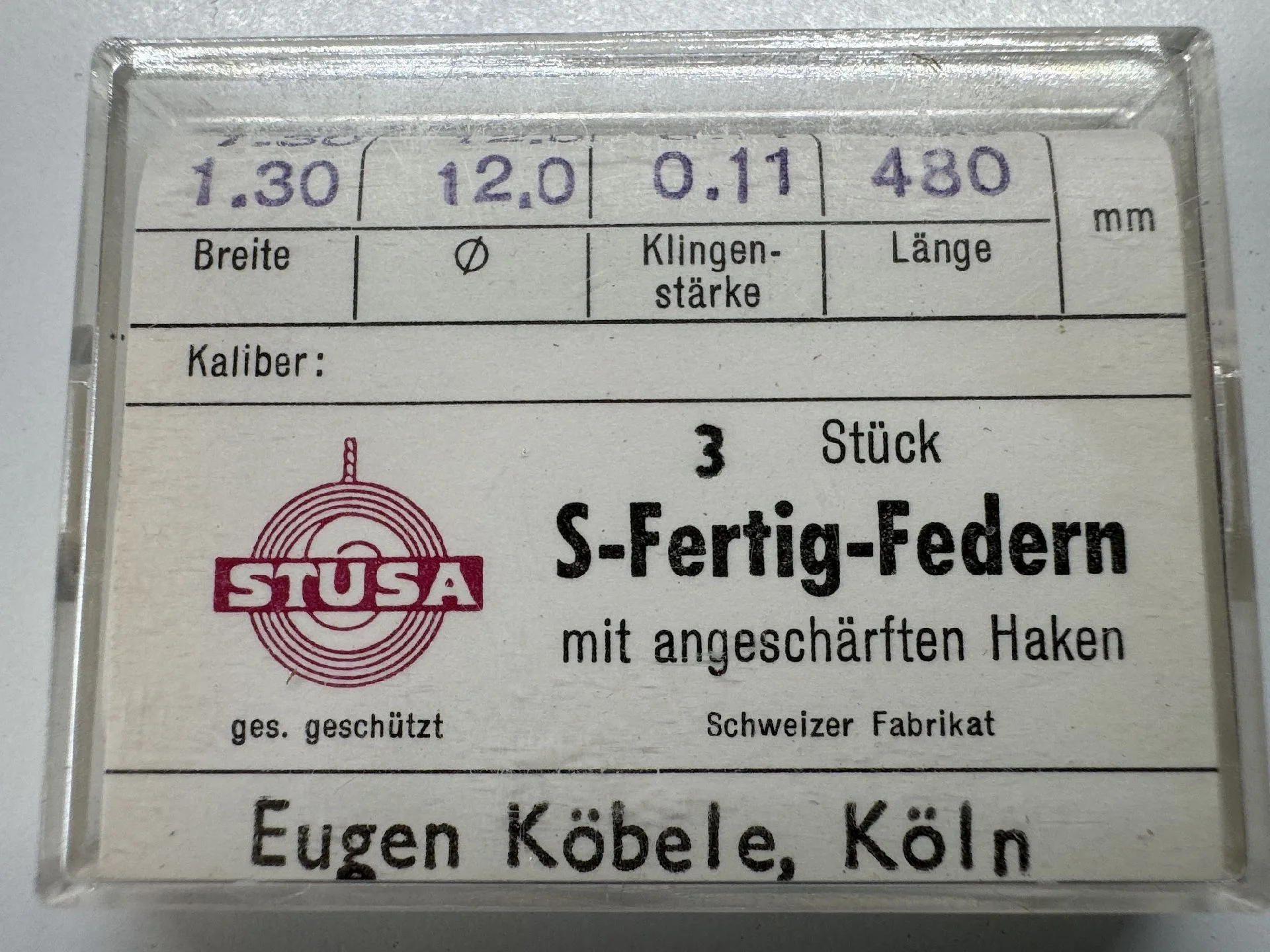 S-Fertig-Federn Set Set mit drei Uhrmacher-Federn mit angeschärften Haken in transparenter Verpackung.