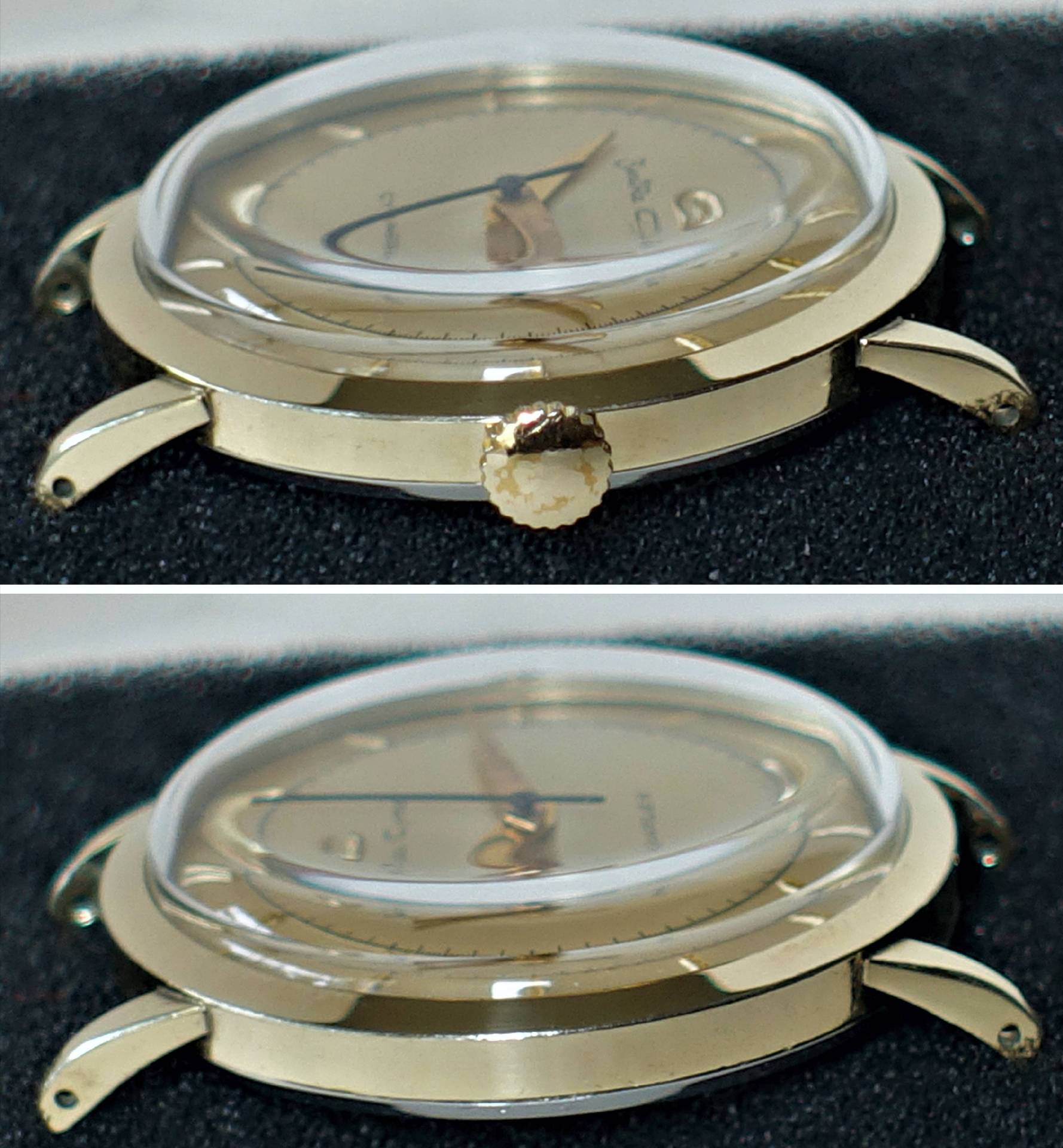 Goldfarbenes Gehäuse einer Armbanduhr mit montiertem Zifferblatt, Zeigern und Glas, ohne Armband.