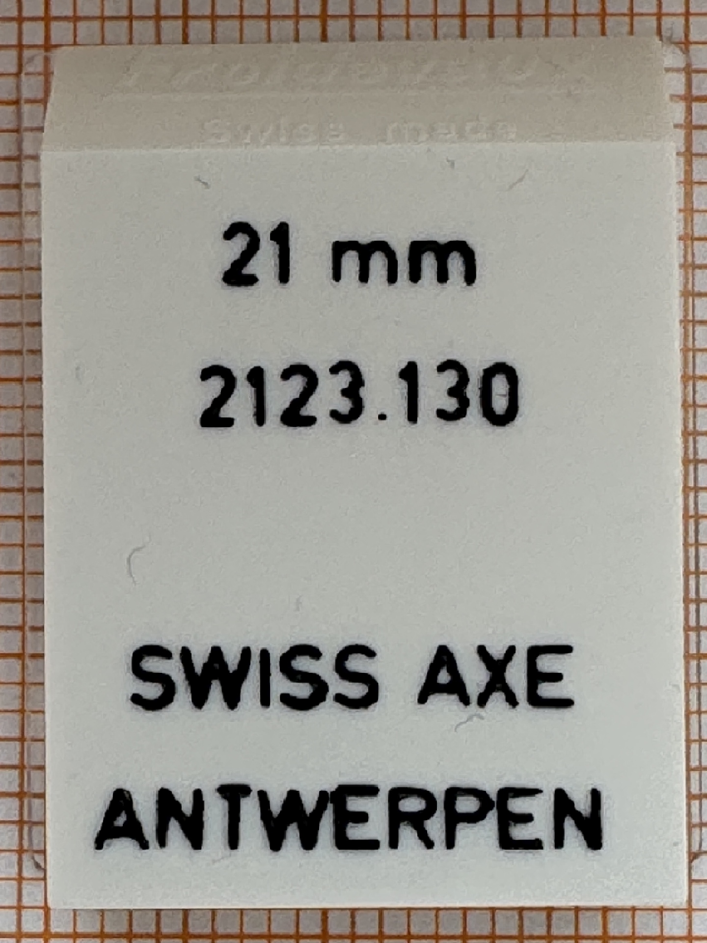Weißes Tütchen mit Aufdruck für eine 21 Millimeter Dichtung, Ersatzteil für Uhren.
