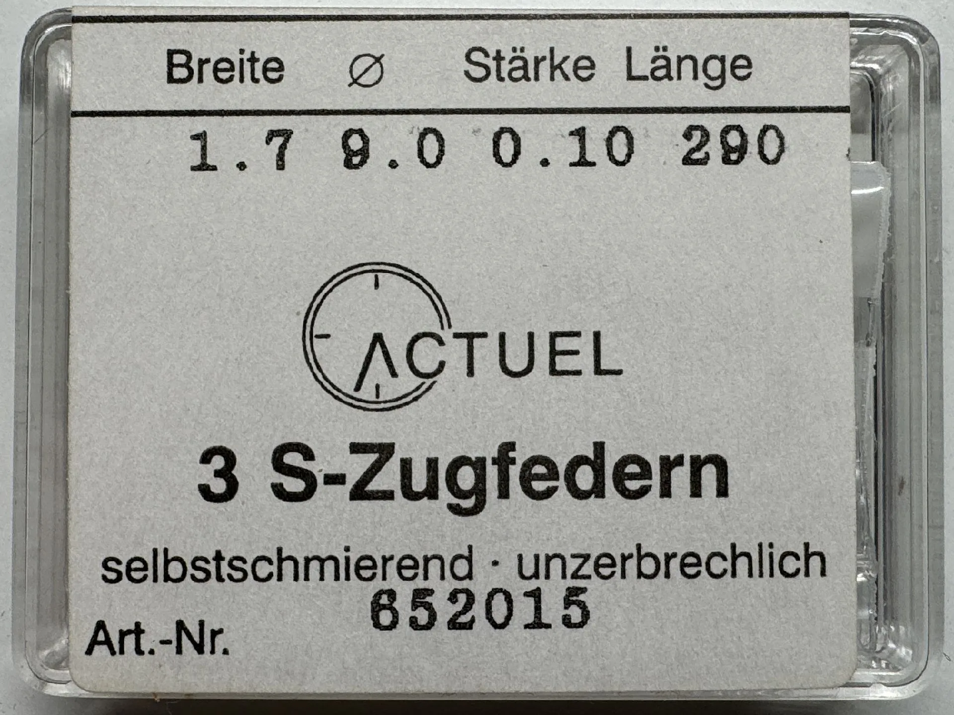 Zugfeder Set Set mit drei silberfarbenen Zugfedern für Uhren in transparenter Verpackung.