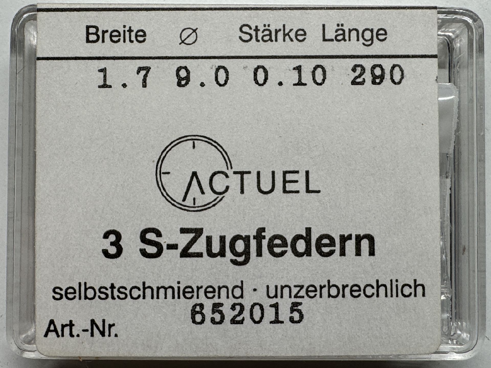 Set mit drei silberfarbenen Zugfedern für Uhren in transparenter Verpackung.