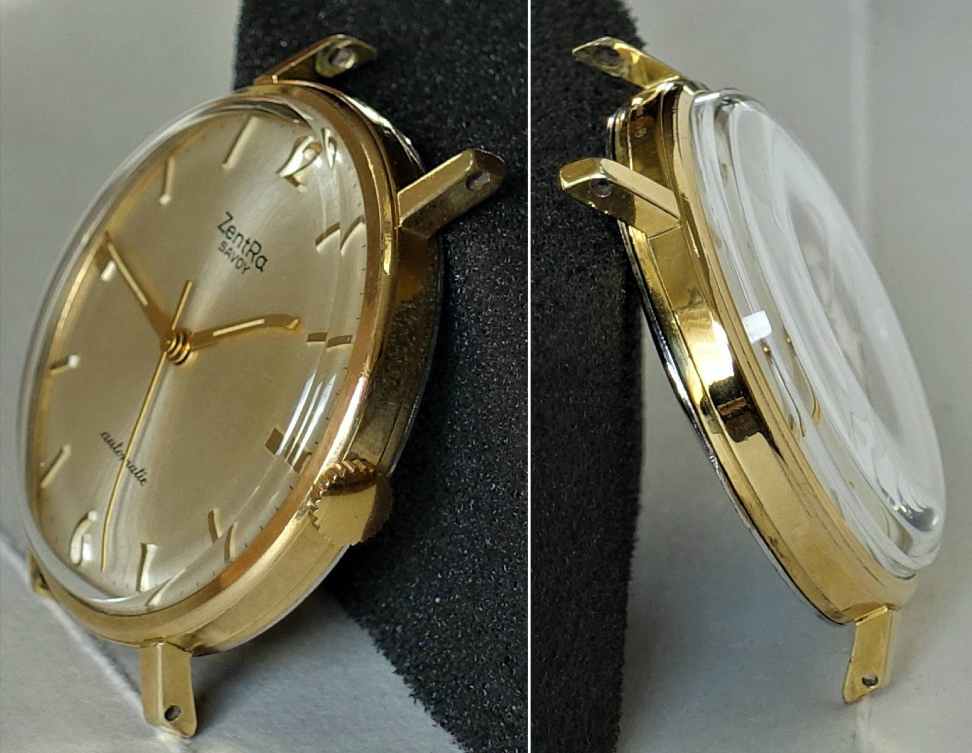 Goldfarbene Armbanduhr mit hellem Zifferblatt und goldenen Zeigern, ohne Armband.