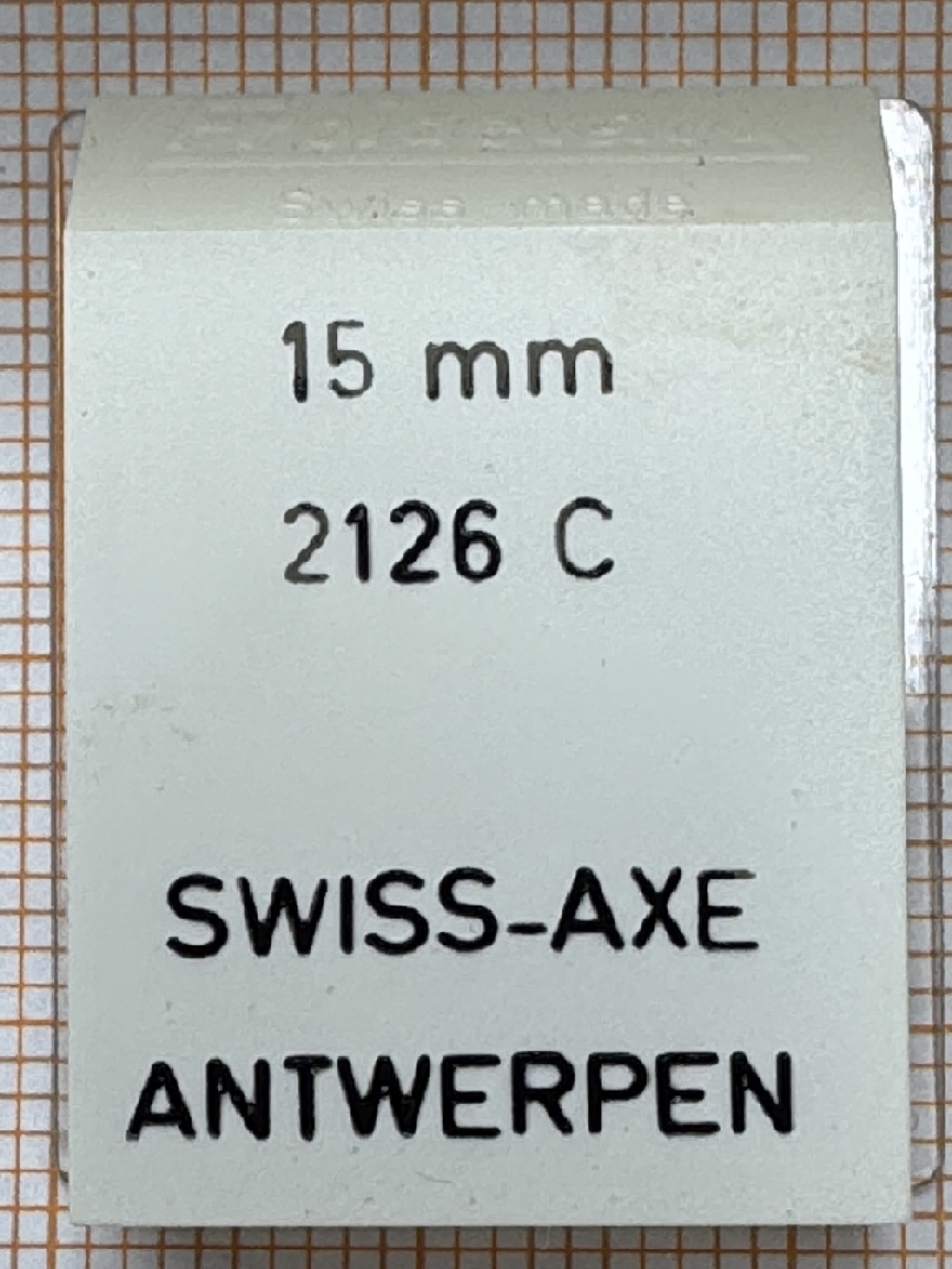 Verpackung eines Swiss-Axe Uhrenteils mit der Aufschrift 15 mm und 2126 C.
