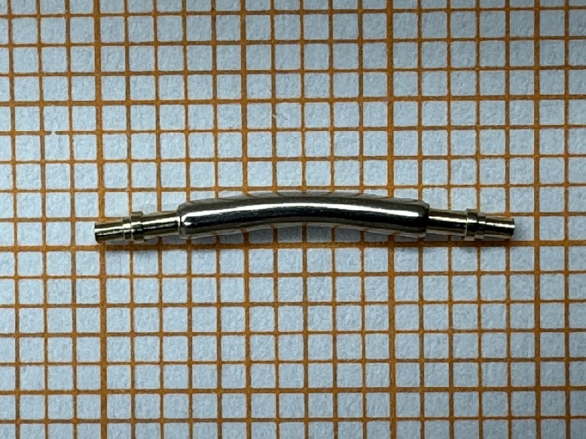 Gebogener Federsteg aus Metall für Uhrenarmbänder.