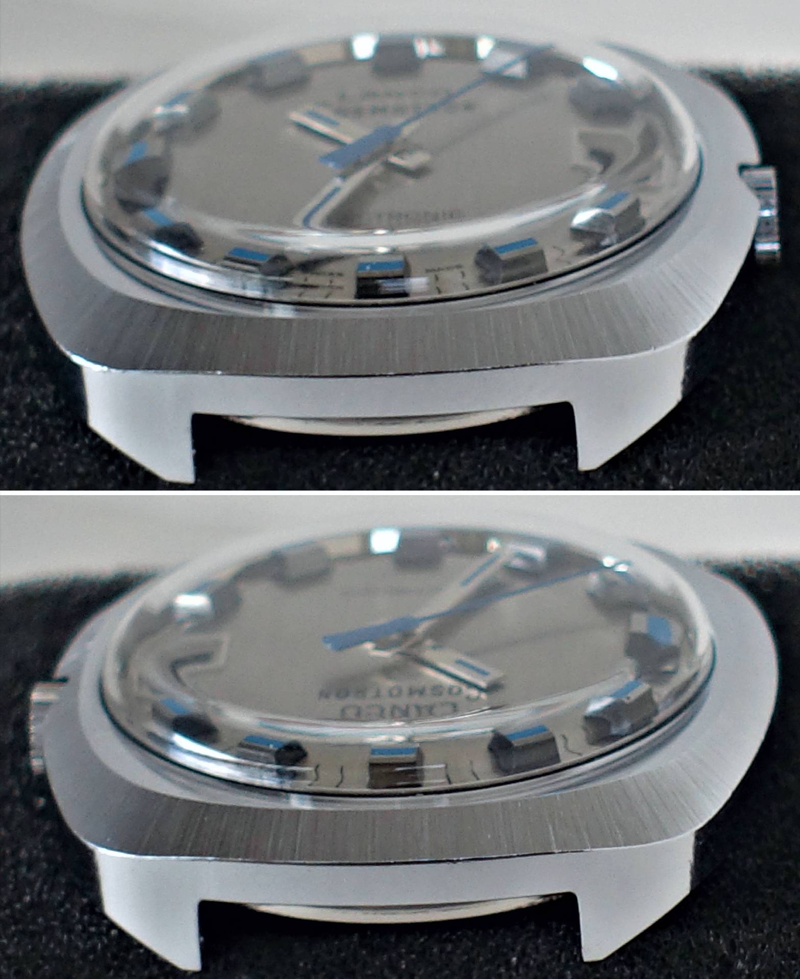 Silberfarbenes Gehäuse einer Armbanduhr mit silbernem Zifferblatt und blauen Zeigern.