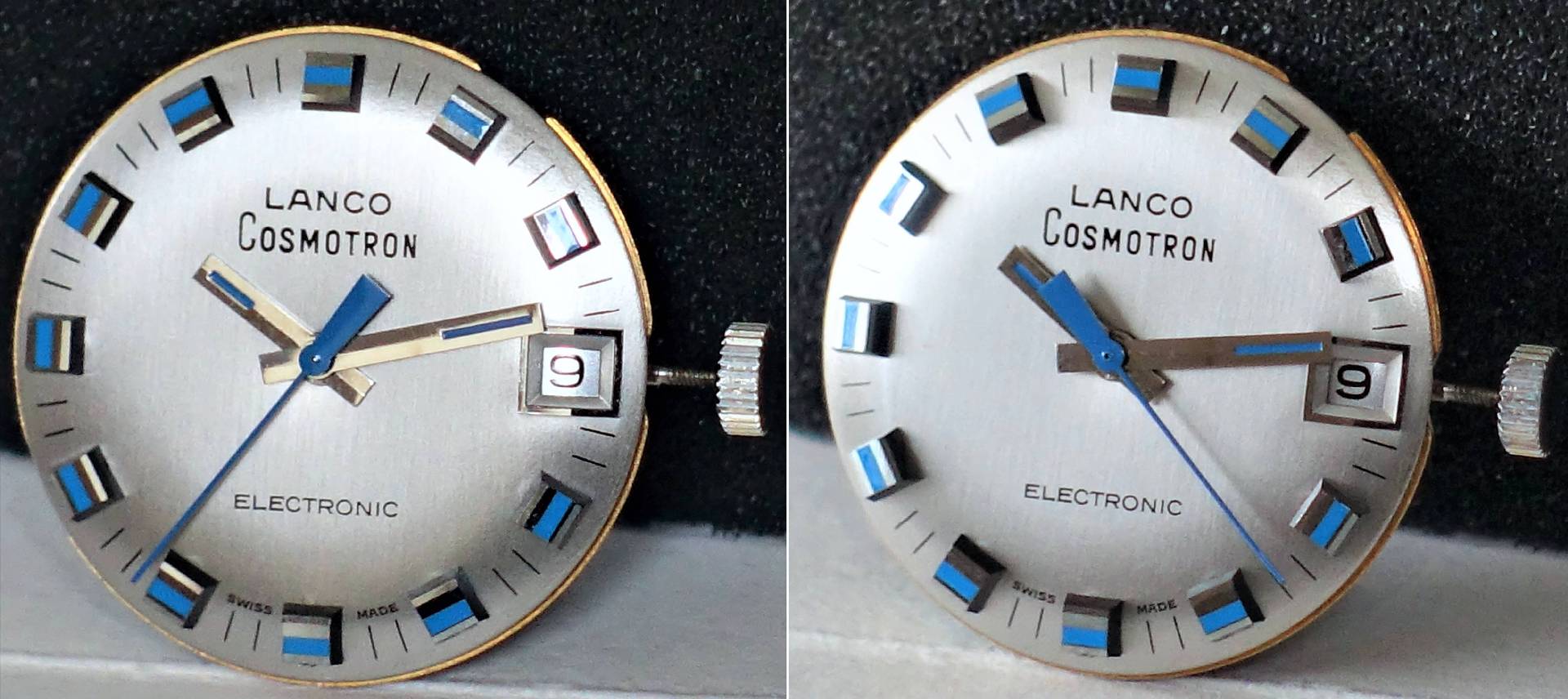 Silbernes Zifferblatt einer Lanco Cosmotron Uhr mit blauen und schwarzen Indizes, Datumsanzeige und blauen Zeigern.
