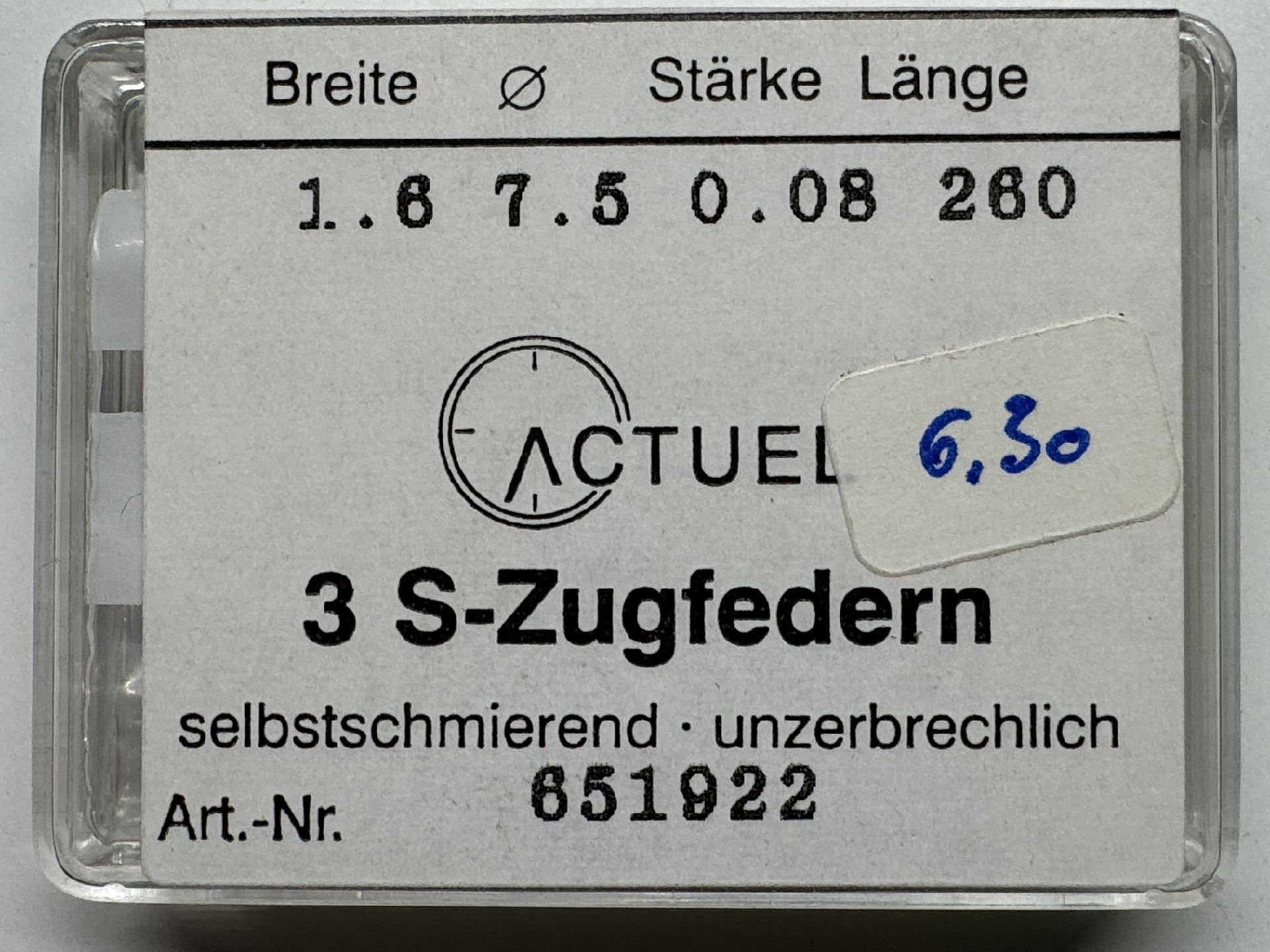 Set mit drei silberfarbenen Zugfedern für Uhren in transparenter Kunststoffbox.
