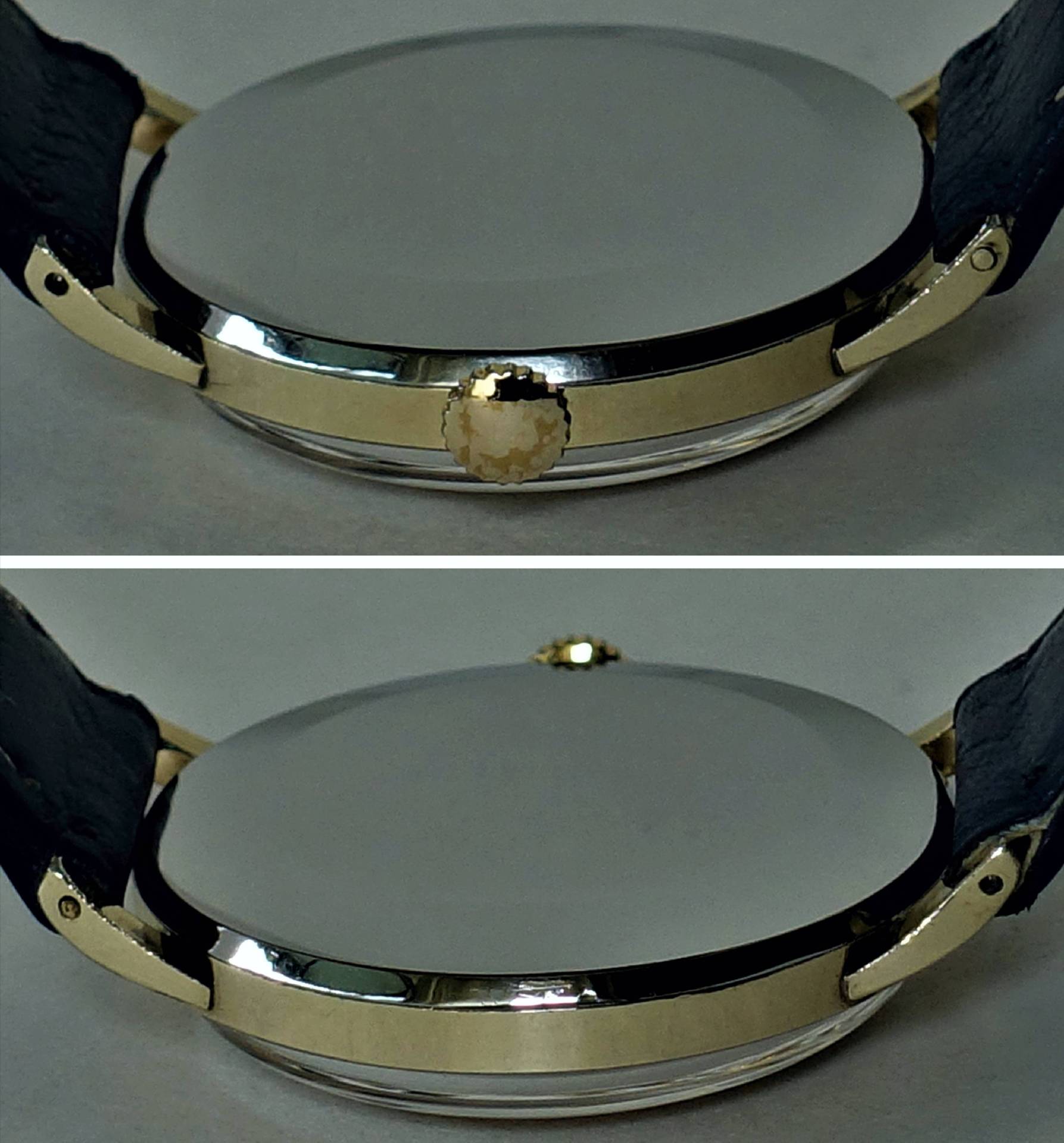 Rundes, goldfarbenes Gehäuse einer Armbanduhr mit seitlicher Krone und schwarzem Armband.