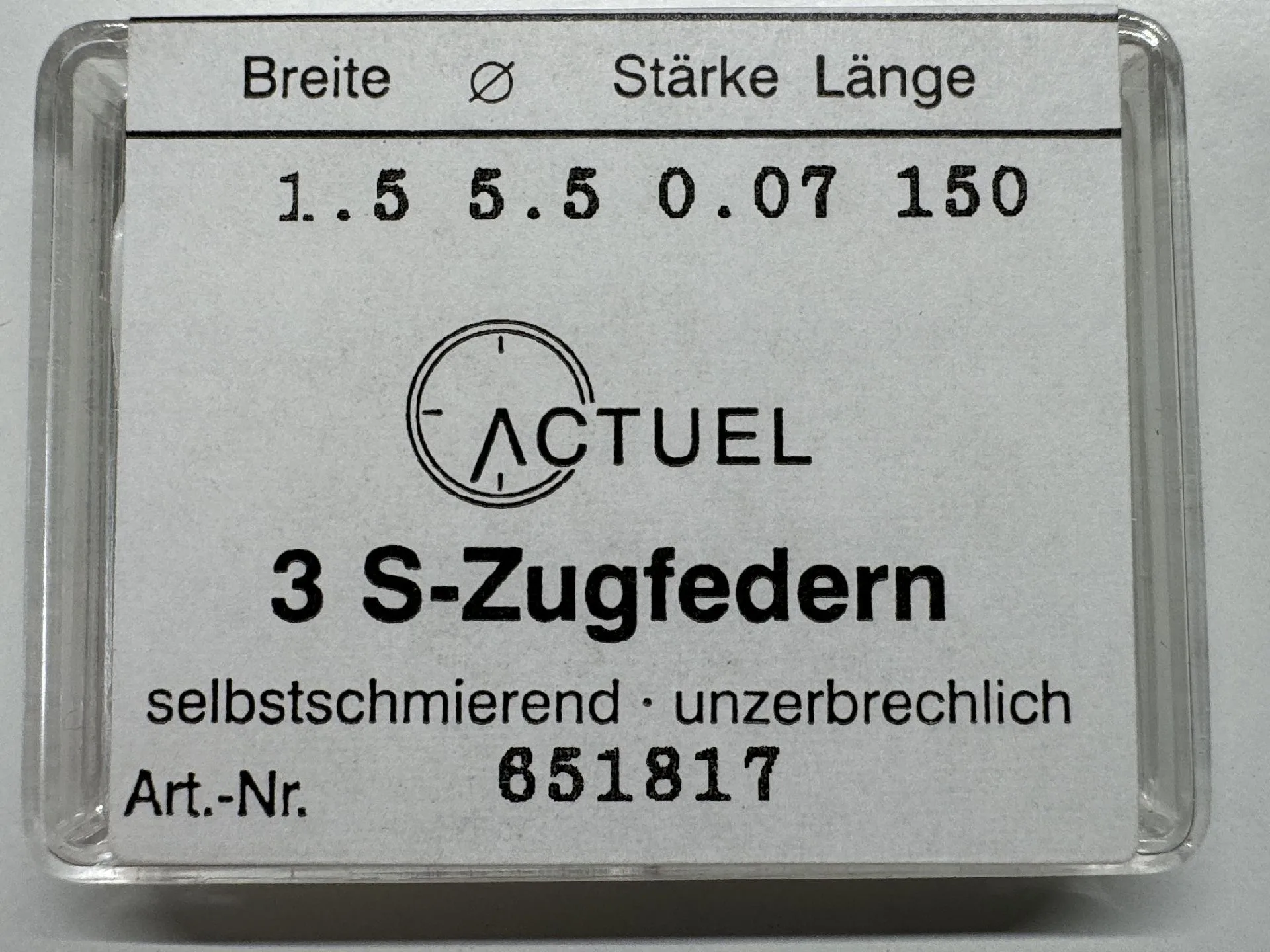 S-Zugfedern Set Verpackung mit drei selbstschmierenden S-Zugfedern für Uhren.