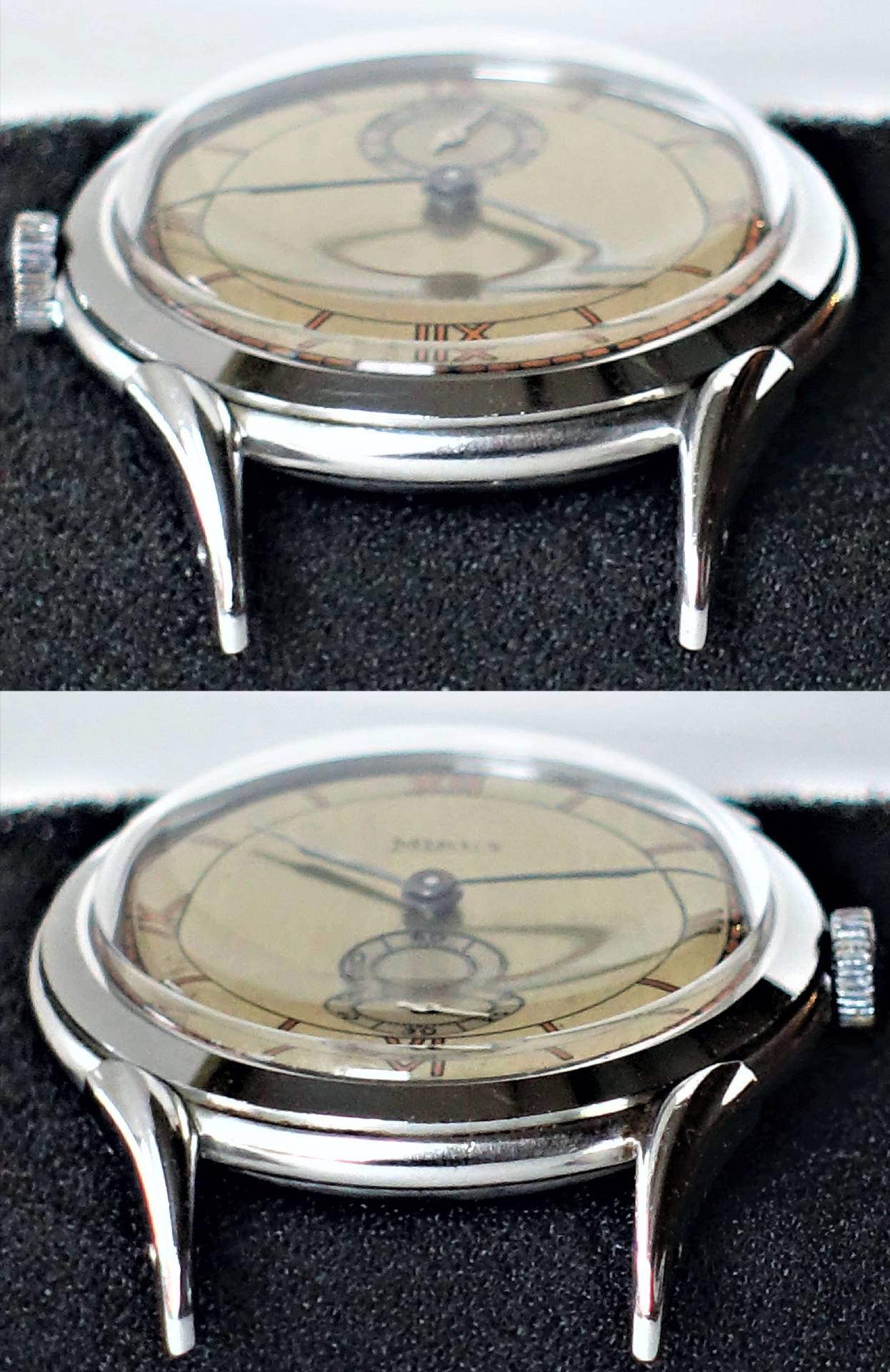 Eine Armbanduhr mit beigem Zifferblatt und silberfarbenem Gehäuse liegt auf schwarzem Stoff.