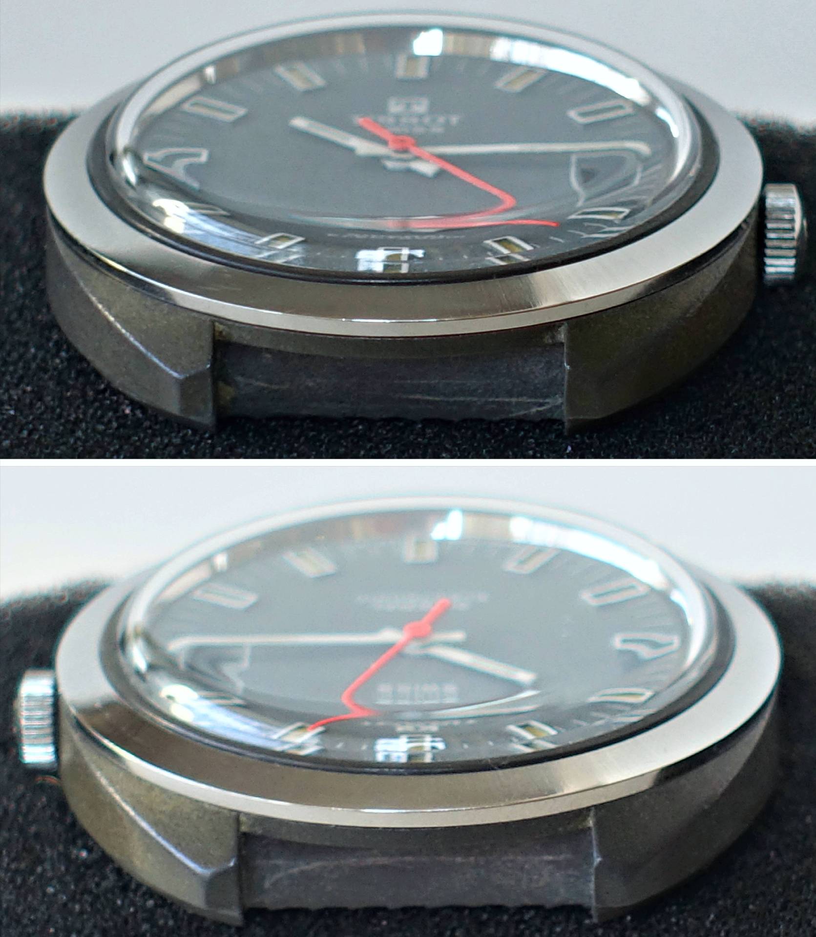 Seitliche Nahaufnahme einer Armbanduhr mit schwarzem Zifferblatt und rotem Sekundenzeiger auf dunklem Stoff