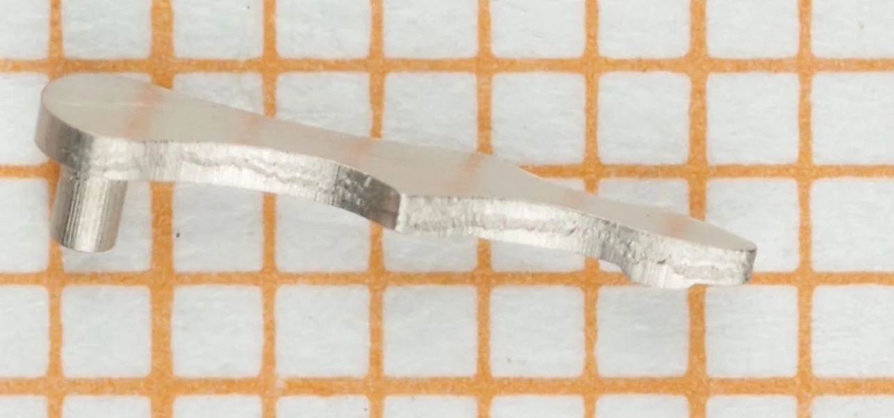 Uhrwerk Hebel Metall Metallischer Hebel als Ersatzteil für ein Uhrwerk.