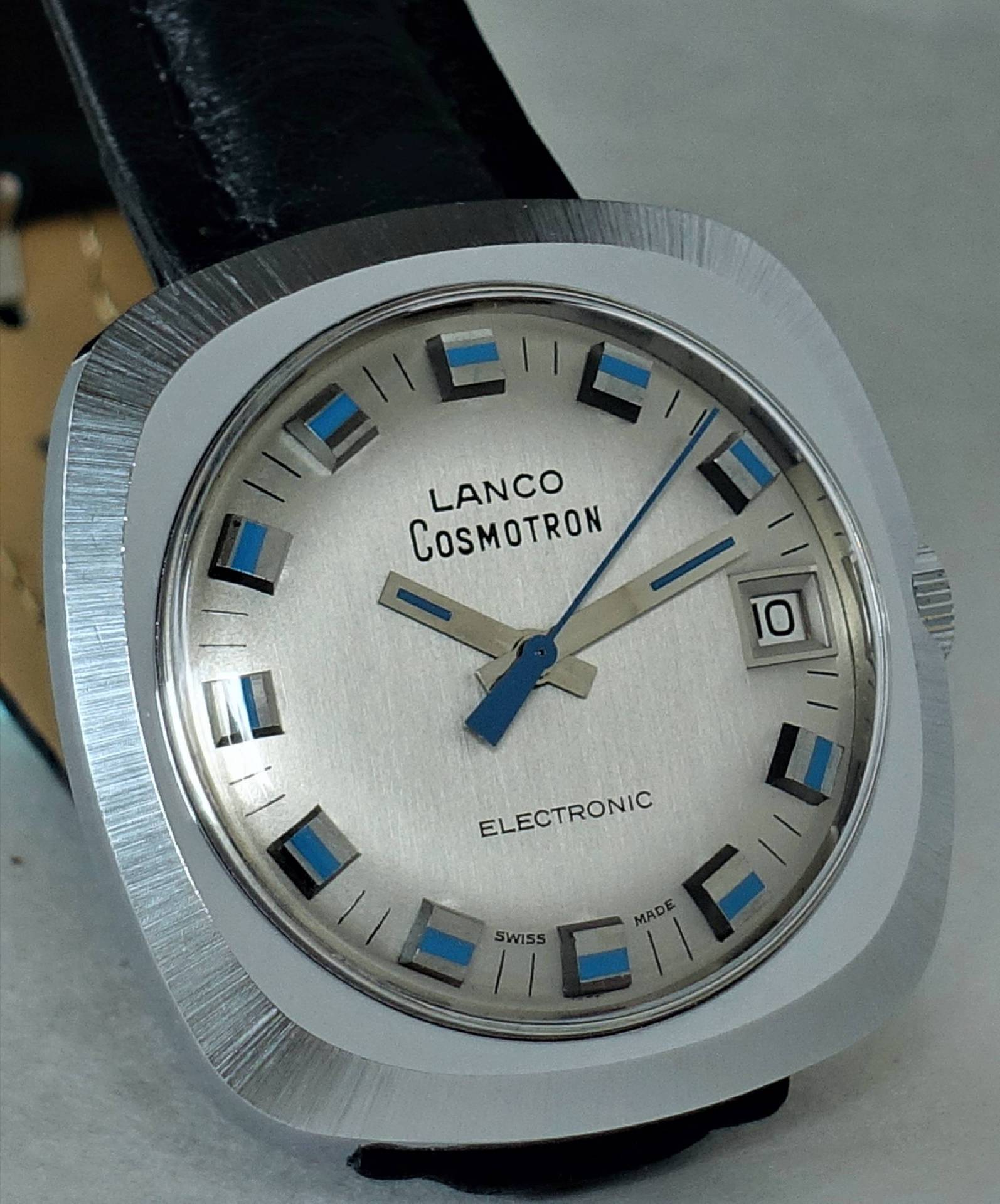 Silberfarbene Lanco Cosmotron Armbanduhr mit schwarzem Armband und Datumsanzeige.