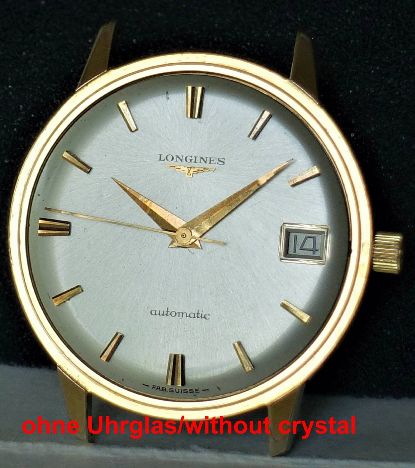 Goldfarbene Longines Armbanduhr ohne Uhrglas mit silberfarbenem Zifferblatt und Datumsanzeige.