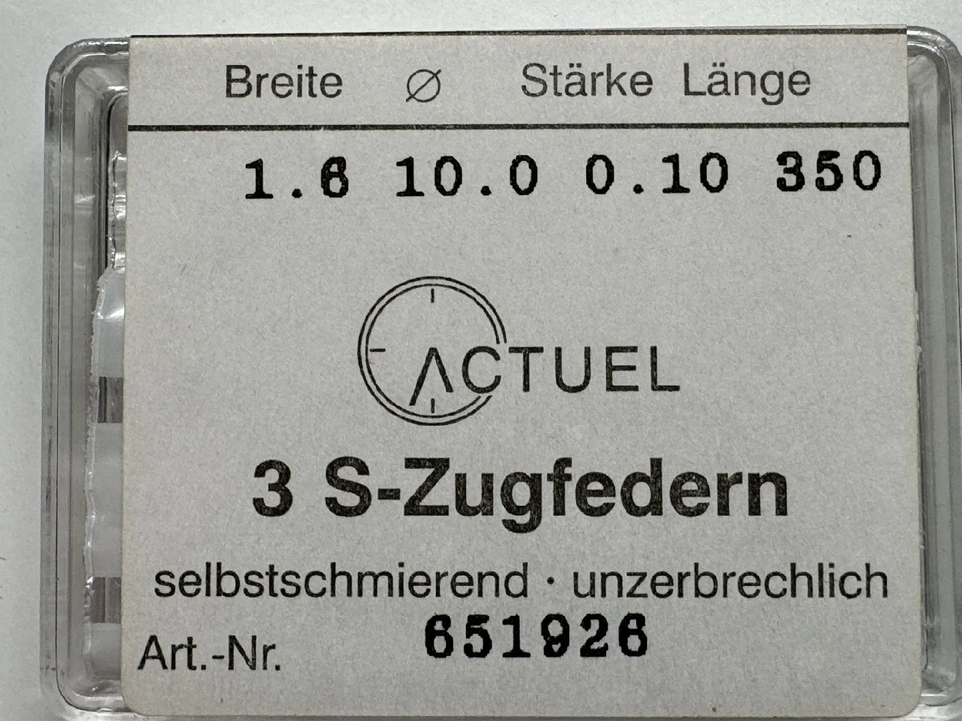 Zugfeder Set silberfarben Drei silberfarbene Zugfedern für Uhren in transparenter Verpackung.