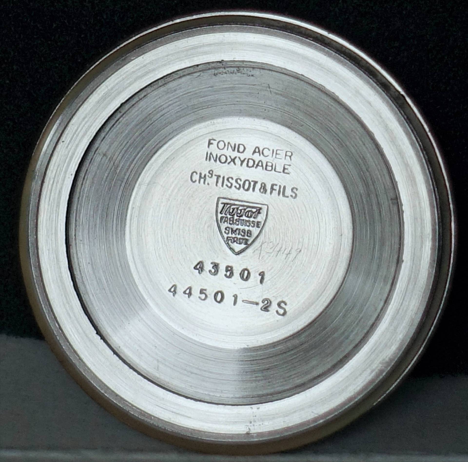 Silberfarbener Edelstahlboden für Tissot Armbanduhren mit Gravur und Modellnummern.
