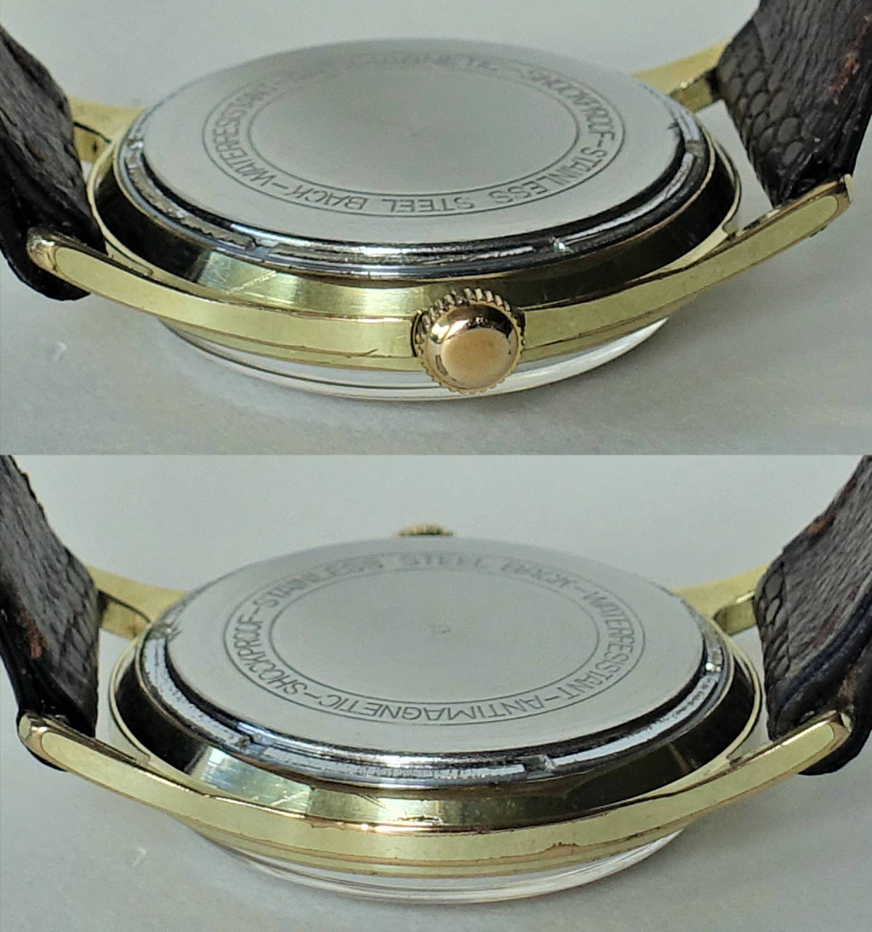 Rückseite einer goldfarbenen Armbanduhr mit silberfarbenem Gehäuseboden und braunem Armband.