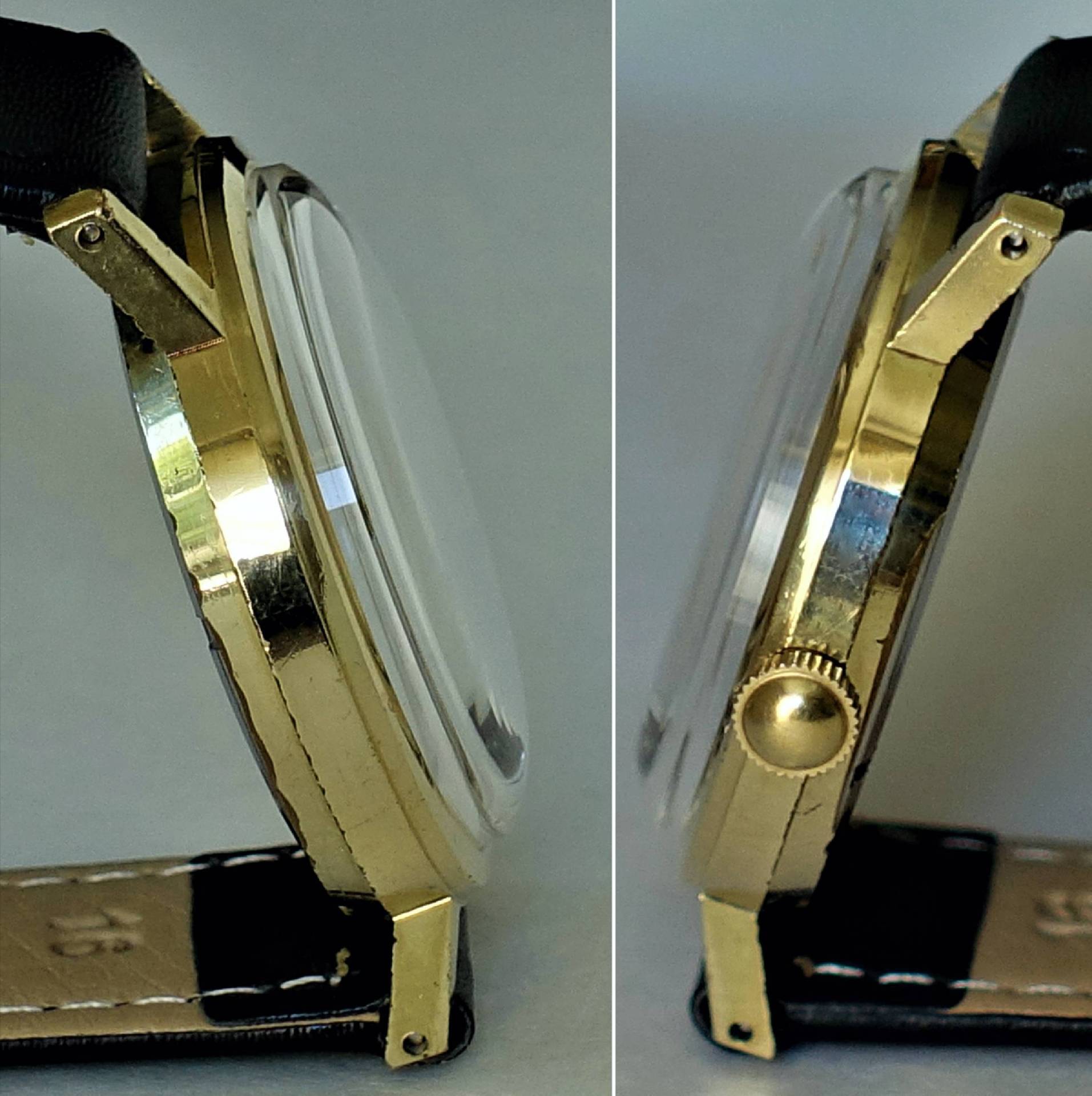 Goldfarbene Armbanduhr mit schwarzem Lederarmband und gewölbtem Uhrglas, seitlich fotografiert.