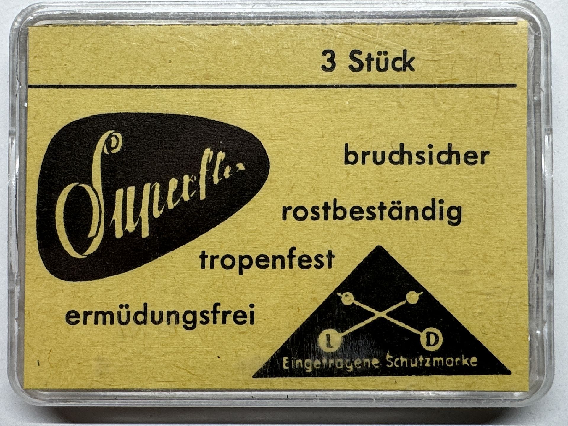 Gelbe Verpackung mit drei bruchsicheren, rostbeständigen Federstegen für Uhren.